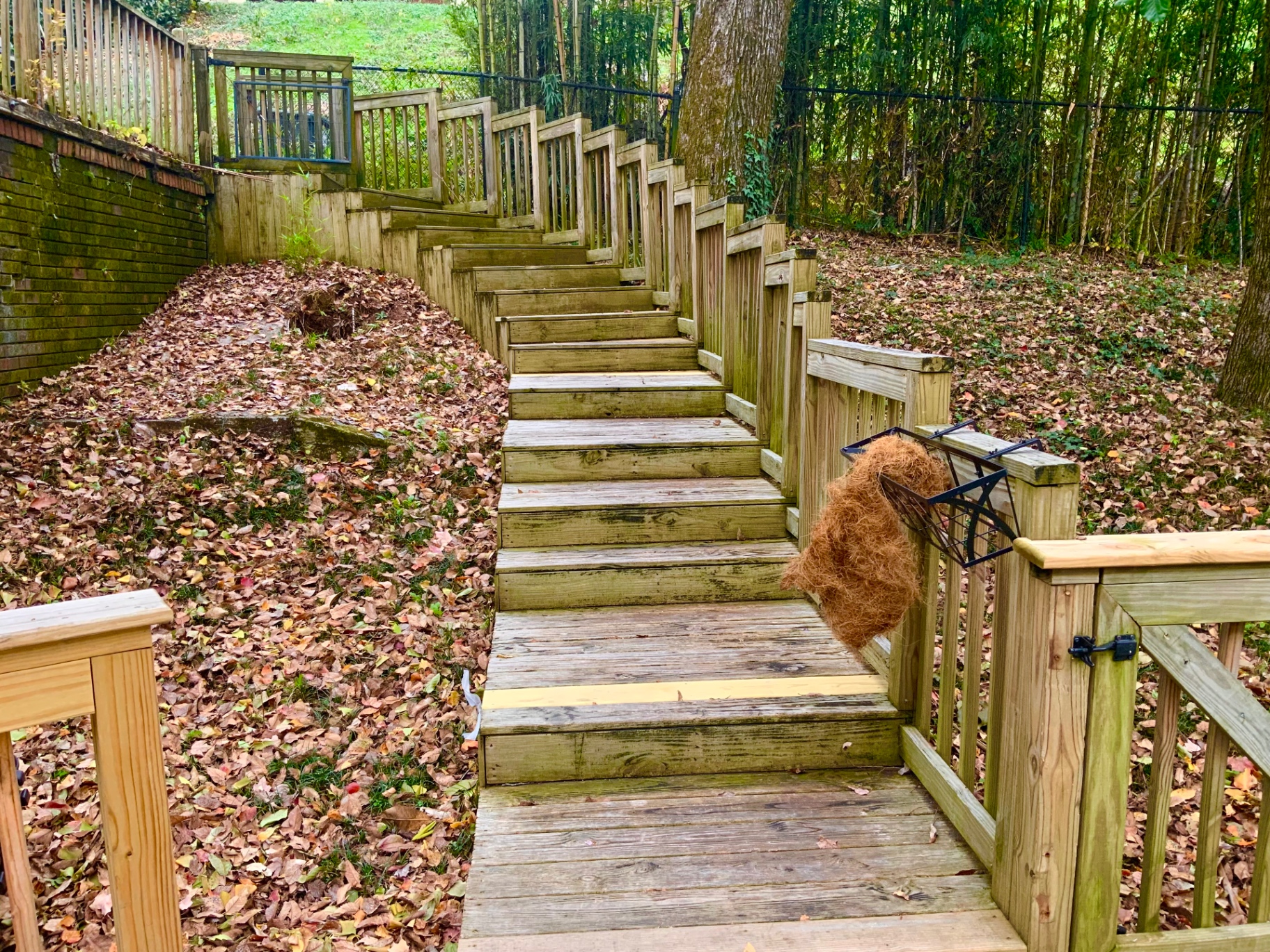 Custom wooden stairway built into a hillside landscape